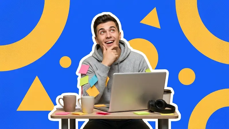 A young man daydreaming at a desk covered in sticky notes