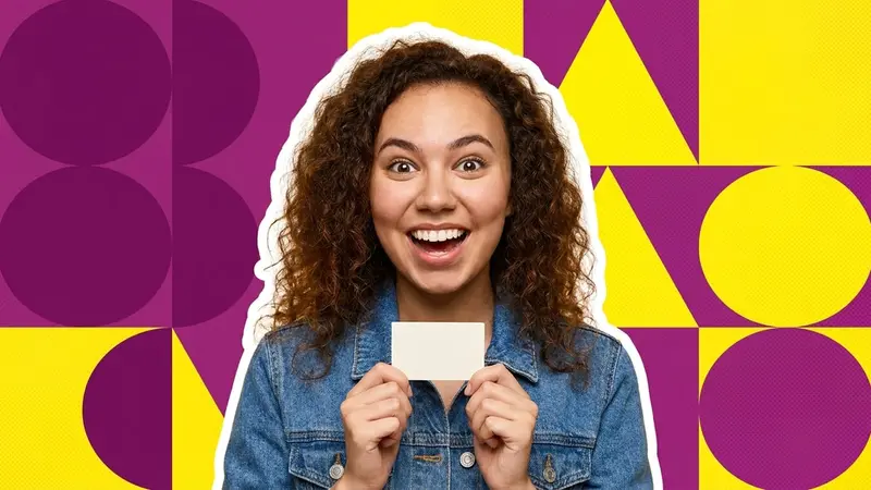 A delighted young woman holding a small blank card to her chest as if she has just read a name on it