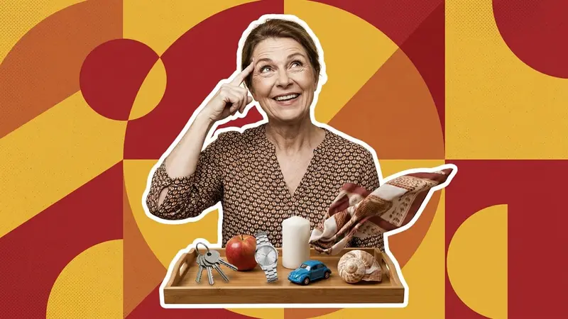 A woman lifting a cloth off a tray of objects, trying to remember them