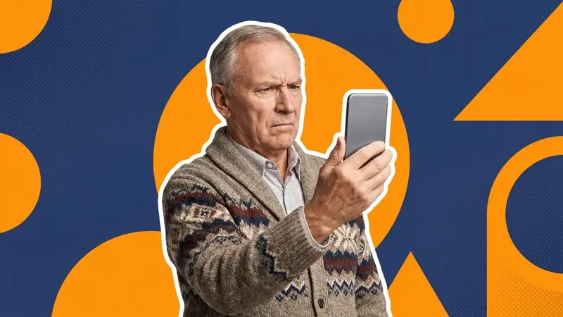 An older man squinting suspiciously at his phone